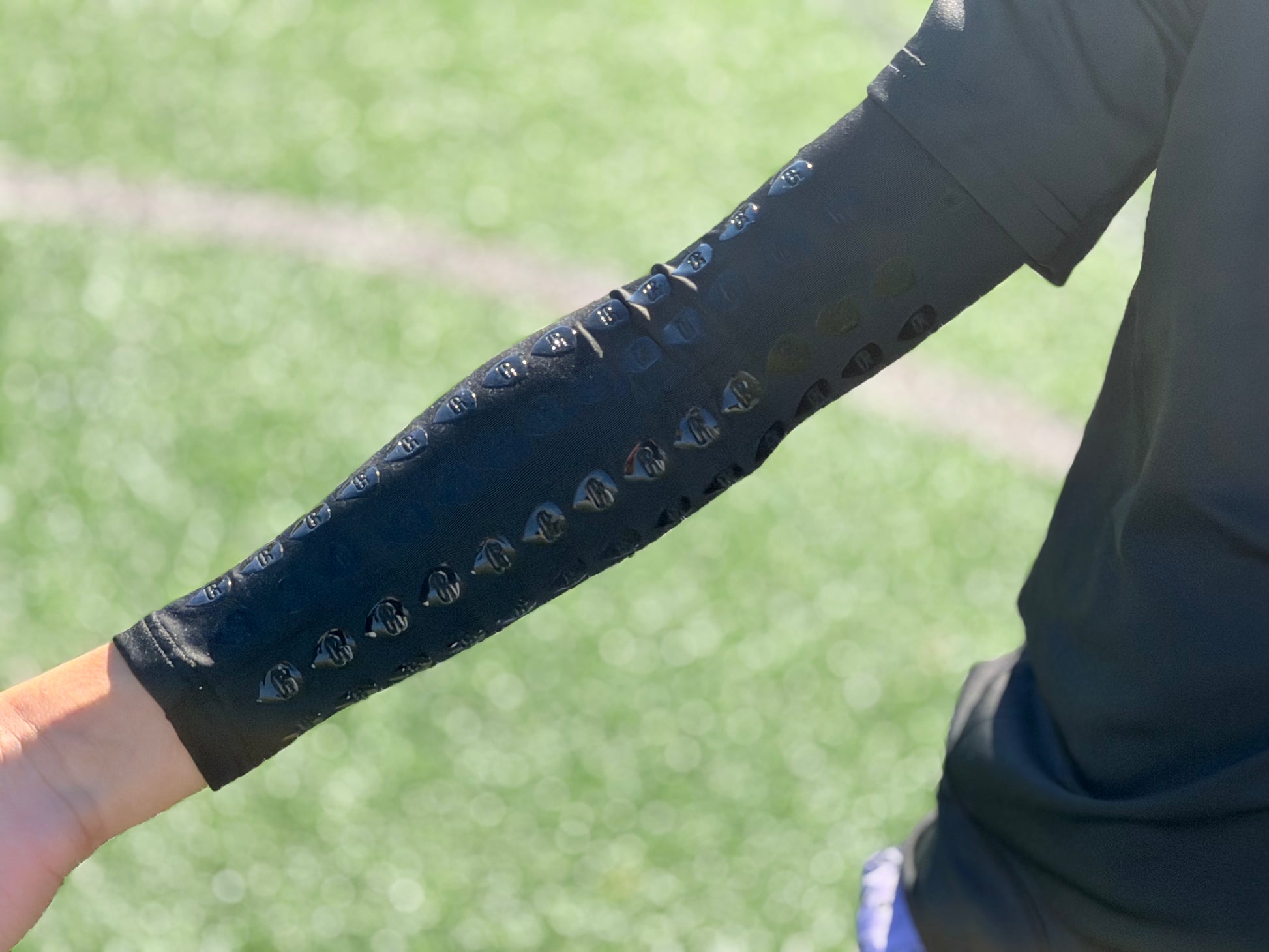 Black football youth compression arm sleeve with grip