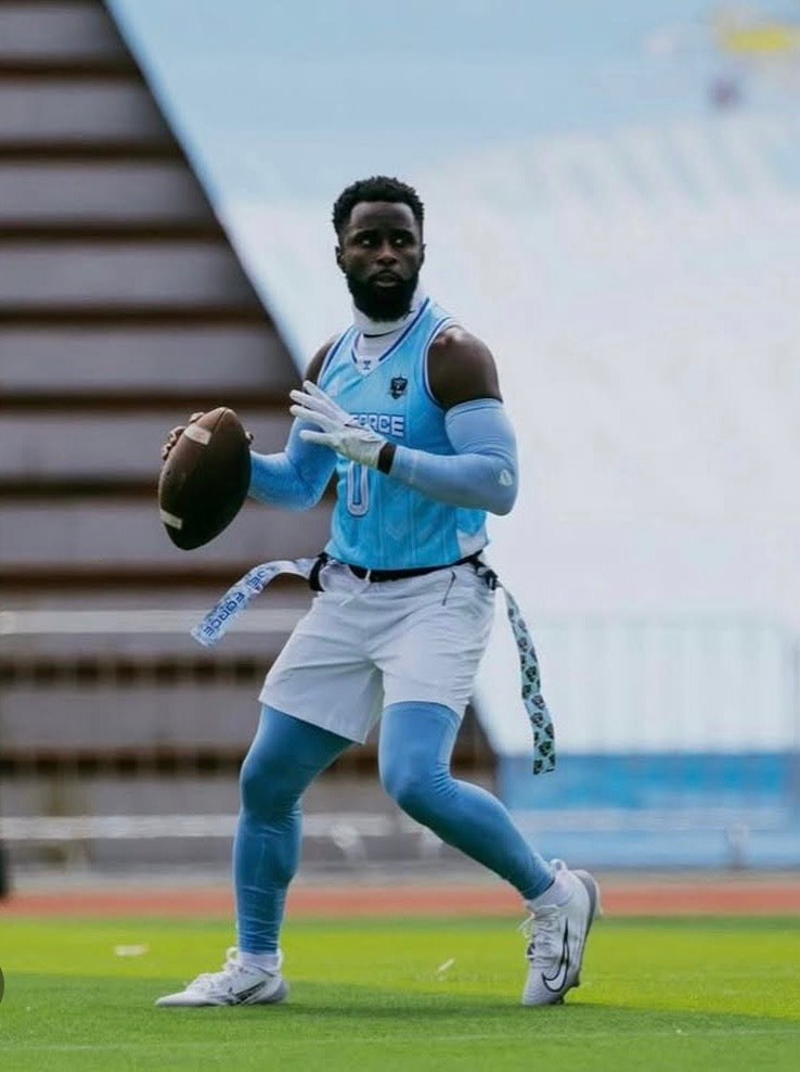 quarterback wearing columbia blue compression arm sleeves with grip